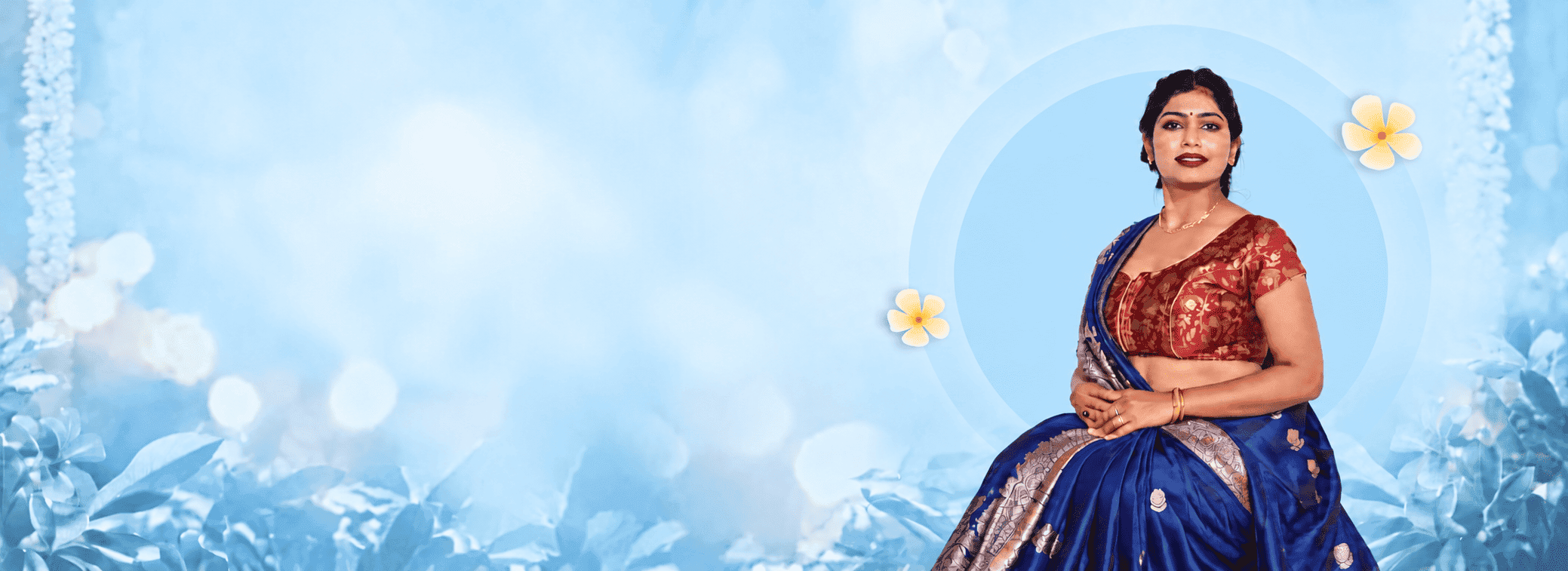 Model in a royal blue Banarasi silk saree with a silver zari border and a maroon brocade blouse